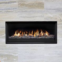 a modern fireplace is shown in the middle of a room with marble walls and flooring