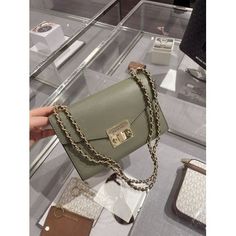 9"x6"x2.5" the tag says medium, the actual size is between small and medium. new with original packaging flexible chain strap, the length is about 20" 1 inner pocket, 1 zip compartment Color: Green.  Gender: female.  Age Group: adult. Michael Kors Rectangular Shoulder Bag With Chain Strap, Everyday Michael Kors Shoulder Bag With Chain Strap, Michael Kors Rectangular Bag With Chain Strap, Trendy Michael Kors Bag With Chain Strap, Michael Kors Crossbody Bag, Media Logo, Zip Tote, Small Crossbody Bag, Small Crossbody