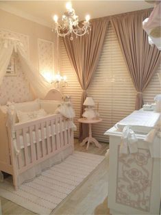 a baby's room is decorated in pink and white