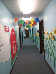 the hallway is decorated with colorful flags and paper flowers