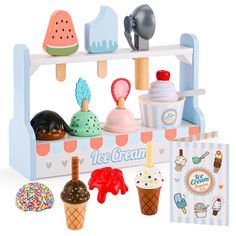 an ice cream stand with different types of ice creams and cupcakes on it