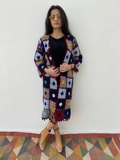 Beautiful unique geometric floral patterned wool crochet hand embroidered textile piece up-cycled into a open coat/robe. Vintage long wool cotton cardigan / coat Perfect for layering as a lunch outfit or a festival coat Effortlessly easy fit In a perfect condition Garment Measurements Chest 40 inch Shoulder 15 inch Sleeve 18 inch Length 37 inch Should fit S or M easily Please Note: Due to use of Vintage fabric almost 20-50 years old that has been up cycled, there might be some imperfections or l Coachella Jacket, Granny Square Crochet Cardigan, Long Crochet Cardigan, Festival Coats, Lunch Outfit, Open Coat, Crochet Festival, Wool Crochet, Cardigan Kimono