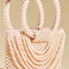 Elegant Beaded Vintage Satchel Product Details * Plastic Pearl Beads * Unlined * Imported Dimensions * 10"L, 8"H, 2"D * 5.5" Handle Drop Summer Evening Bag Made Of Pearl, Summer Evening Pearl Bag, Chic Pink Beaded Shoulder Bag, Elegant Beaded Summer Bags, Summer Beaded Bag Fashion Accessory, Summer Beaded Bags As Fashion Accessory, Summer Fashion Beaded Bag, Elegant Embellished Shoulder Bag For Summer, Elegant Embellished Summer Bags