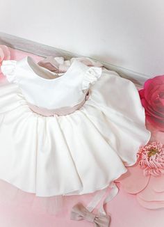 Ivory baby dress Baby girl dress First birthday dress Birthday party dress  Infant girl dress Satin dress Ivory baby girl Baby outfit Formal clothes Dresses for babies Dress size 6 months dress 1 year dressDescription Simple and gorgeous baby dress for her first birthday party. Features:- fully cotton lined;- tea length (middle calf);- short puffed sleeves;- open v back;- satin sash and bowCan be customized fir any desired length/color of the dress/tulle skirt/ sash color.*Price include only dre Elegant Cream Tutu Dress With Ruffles, White Bow Dress For Birthday, Elegant Baptism Tutu Dress With Bow, Elegant Tutu Dress With Bow For Baptism, White Bow Dress For First Birthday, White Dress With Bow For First Birthday, Cream Ruffled Dress For Baptism, Satin Princess Dress With Ruffles For Party, Pink Fitted Satin Princess Dress