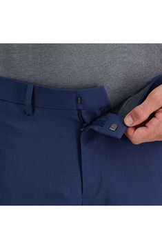 These slim-fit dress pants feature a stylish flat front and moisture-wicking capabilities that make them perfect for both the workday and weekend events. A flex waistband that stretches up to one inch on your midsection provides lasting comfort and flexibility as you move through your day. 32" inseam; 14" leg opening (size 30x32) Zipper fly with hook and bar closure Belt loops Dual pockets 64% polyester, 34% viscose rayon, 2% elastane Dry clean Imported Fitted Business Casual Bottoms With Hidden Pockets, Fitted Dress Pants With Straight Leg And Hidden Pockets, Fitted Bottoms With Hidden Pockets For Business Casual, Fitted Business Pants With Hidden Pockets, Classic Fitted Pants With Comfort Waistband, Fitted Dress Pants With Hidden Pockets For Business Casual, Fitted Business Bottoms With Hidden Pockets, Fitted Dress Pants With Hidden Pockets And Tapered Leg, Business Stretch Solid Dress Pants