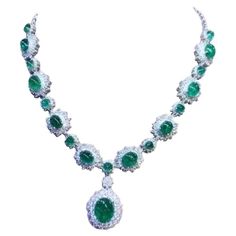 An exquisite design , very glamour and refined, by Italian designer , a very piece of art. Necklace come in 18k gold , with 18 pieces of natural Zambia emeralds, oval cabochon cut, fine quality , of 46,80 total carats. Pendant emerald is of 12,56 carats. Necklace come with natural diamonds of 13 carats,F/VS top quality. On this necklace , pendant is mobile, but on request , I can do fix . It is a high jewelry piece. Handcrafted by artisan goldsmith. Excellent manufacture and quality. Complete with AIG report. Whosale price. Note: on my shipment, customers not pay taxes and duty. Art Necklace, 18k Gold Necklace, Fairy Jewelry, Zambian Emerald, 18k Gold Ring, Expensive Jewelry, Modern Ring, Italian Designer, Zambia