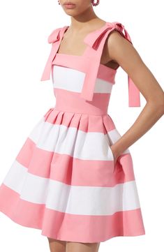 Oversized bows at the shoulder straps elevate the playful aesthetic of this striped sundress whose fitted bodice balances the voluminous short skirt. Exposed back-zip closure Square neck Side-seam pockets 92% cotton, 8% polyamide Dry clean Made in the USA Designer Clothing Hispanic & Latinx Owned/Founded Fashion Teens, Carolina Herrera Dress, Carolina Herrera Dresses, Shell Pink, Striped Mini Dress, Short Skirt, Carolina Herrera, Pink Dress, Sundress