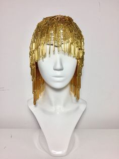 "This is our first stage collection of accessories, that features 20's inspired performance headpieces. The wig is made from long bugle beads and is a piece of art in terms of time consumption and intricate beading. It has a pre-made forehead piece that is a beaded center part. The wig is pretty heavy but therefore feels very stable and good quality. It has a proper wig cap in black underneath to keep it well on the head. Can be made in different colours: gold, silver, black. Beretk!Ah... has a Cranberries Zombie, The Cranberries Zombie, Man Wig, Art Deco Accessories, Statement Hair, Beaded Headpiece, Burlesque Show, Men's Wigs, Gold Color Palettes