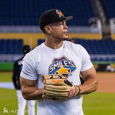 a baseball player wearing a catchers mitt on the field