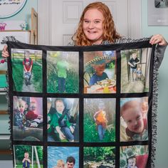 a woman holding up a blanket with photos on it