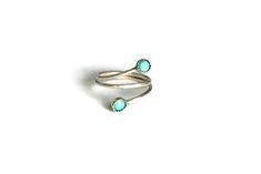 Reveal your inner bohemian goddess with this stunning sterling silver genuine turquoise stacking ring ▲ .925 sterling silver ▲ Genuine 4mm turquoise stones ▲ Available in sizes 1-10 ▲ If you intend to wear this as a midi ring the recommended size is three sizes below your normal ring size, the average midi ring size is 3 1/2 :) Please visit www.childrenofflowers.com for even more designs! Please copy and paste this link for an international ring size conversion chart-http://www.tradeshop.com/mas Turquoise Stackable Dainty Jewelry, Dainty Turquoise Stackable Ring, Dainty Turquoise Ring Jewelry, Dainty Hand-wrapped Silver Rings, Dainty Adjustable Turquoise Promise Ring, Bohemian Sterling Silver Turquoise Wedding Ring, Unique Nickel-free Stackable Rings, Dainty Turquoise Open Ring, Handmade Turquoise Stackable Rings In Sterling Silver