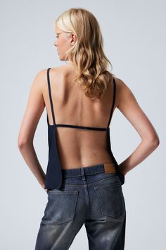 fleur suiting open back top - Dark Blue | Weekday WW Chic Stretch Elastane Camisole, Chic Stretch Camisole, Chic Crop Top With Built-in Bra And Minimal Stretch, Backless Summer Tops With Built-in Bra, Sleek Fitted Crop Top For Summer, Stretch Tie-back Backless Top, Stretch Backless Top With Tie Back, Summer Backless Top With Built-in Bra, Chic Stretch Tank Top With Tie Back