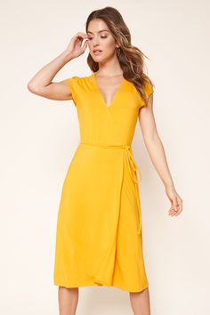 Annecy Jersey Knit Midi Wrap Dress is perfect to wear out to brunch or just lounging around. This is a soft stretch jersey dress with a fitted at the bodice that flares at the waist, giving you shape and comfort at the same time. Pair it with your favorite heels or sandals for a cute and chic look.- Cap sleeve- Midi wrap dress- Modesty snap at neckline- Soft stretchy knit jersey fabric- Comes in 2 colorsSize + Fit - Model is 5'9" and wearing size S - Measurements taken from size S - Chest: 34 1/ Office Capsule, Job Office, Yellow Wrap Dress, Petite Curvy, Outfit Short, Yellow Dresses, Knit Wrap Dress, Jersey Knit Dress, Wrap Around Dress