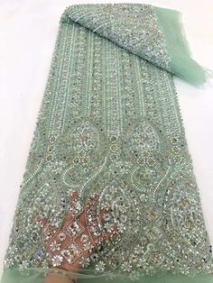 This high quality Fabric is measured in 5 Yards With Embroidered Beading and Sequin. It is soft, very delicate and beautiful. This high Quality Fabric is made with Fashion embroidered rhinestones can be used in making party wedding dresses, skirts, shawls, scarves and other other fashion apparels as you would like. Size : Length : 5 yards (180 inch). Width: 50 inch (Please allow slight deviation for the measurement data ,±1 inch) Material: 100% Polyester, Tulle Lace Fabric, Eco-Friendly embroide Luxury Fabric, Design Fabric, Tulle Lace, Fancy Outfits, Handmade Beads, Wedding Party Dresses, Luxury Fabrics, Lace Fabric, Party Wedding