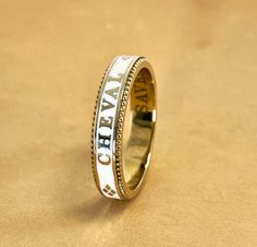 A slim stackable version of our Equus Enamel Ring. Beautiful combination of white enamel and 18 karat yellow gold. 4mm wide Equus (Latin for horse) Cheval (French for horse), stars and a snaffle bit in a continual pattern. Fine beaded detail on both edges. Absolutely gorgeous stacked with the Slim Lace Rein & Diamond Stack rings! Create your own combination! Hand made in the US Made to order, please allow 4-6 weeks for delivery. Snaffle Bit, Stack Rings, Diamond Stacks, Enamel Ring, White Ring, White Enamel, Stacking Rings, Rings For Men, Wedding Rings