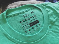 grouper t - shirt sitting on top of each other in different colors and sizes