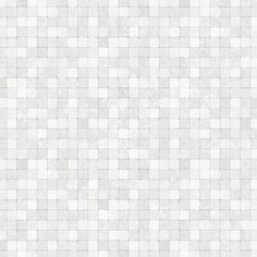 a white tiled wall with small squares on it