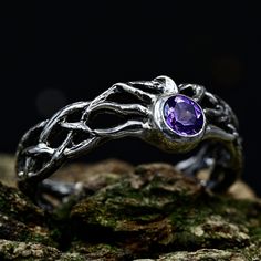 Crafted from sterling silver, our Ethereal Fairy Witchy Wedding Band is a unique and enchanting piece that seamlessly blends fantasy and nature. With intricate details inspired by the magic of a woodland elven realm, this ethereal jewelry captures the essence of a fairy witchy wedding. Ideal for those seeking a unique nature-inspired gift or a dark fairy ring for men, this silver braided ring with twig leaves is a distinctive accessory that adds a touch of enchantment to any occasion.  Characteristics: Metal - Recycled solid sterling silver  Stone - Cubic Zirconia 5.0 mm Finish - Oxidized. View all silver fairy rings: https://www.etsy.com/shop/TinyShinyJewel?ref=seller-platform-mcnav&section_id=4432099 Care instructions: To care for the ring, avoid contact with water and chemicals such as Adjustable Silver Magical Style Rings, Spiritual Wedding Jewelry With Bezel Setting, Mystical Silver Amethyst Ring, Mystical Crystal Promise Ring, Silver Spiritual Stackable Promise Rings, Silver Spiritual Birthstone Ring With Accent Stones, Spiritual Silver Birthstone Ring With Accent Stones, Silver Stackable Promise Rings With Spiritual Style, Silver Fantasy Promise Ring