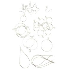 a bunch of different types of earrings on a white background with clippings for each earring