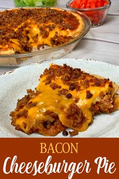 bacon cheeseburger pie on a plate with lettuce and tomatoes in the background