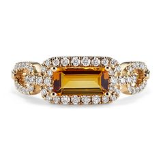 an orange and white diamond ring with two rows of diamonds around the band, set in 18k yellow gold