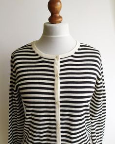 A lovely vintage striped cardigan. Long-sleeved with a round neck and buttons down the front. Cotton fabric, very comfortable. It gives a lovely nautical or French look. Very classic.Size: women's MMeasurements of it laying flat:armpit to armpit- 52cm/ 20.4inlength- 67cm/ 26.3insleeve- 64cm/ 25.1inFabric: 50% cotton, 50% acrylicExcellent vintage conditionCheck out my other items! https://www.etsy.com/shop/naamii Striped Casual Cardigan With Buttons, Casual Striped Button Cardigan, Classic Striped Winter Cardigan, Casual Striped Cardigan With Buttons, Winter Striped Cardigan, Striped Buttoned Cardigan For Spring, Spring Striped Sweater With Button Closure, Striped Long Sleeve Cardigan For Layering, Striped Cardigan For Spring Layering