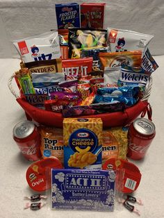 a red basket filled with snacks and candy