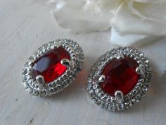 Vintage earrings. Oval earrings with red rhinestone bead, silver metal clip-on, it is not necessary to have holes in the ear. In good vintage conditions, never used. Italian bijouterie. Warehouse fund. Measures 25x20 mm Contact me for any other question. Thank you Oval Earrings, Earrings Clip, Oval Earring, Red Rhinestone, Rhinestone Bead, Vintage Earrings, Clip On, Clip On Earrings, Metallic Silver