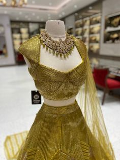 Elevate your bridal look with our Metallic Yellow Bridal Lehenga BL-121! The stunning metallic yellow color, beautifully complemented by intricate foil work, will make you stand out on your special day. Make a bold statement and feel like a princess with this breathtaking lehenga! Fabric: Net with Raw Silk Lining! WASH CARE INSTRUCTIONS - Please Dry clean only when it is applicable! Ready to Ship! Elegant Yellow Sharara With Pallu, Semi-stitched Gold Sharara For Festive Occasions, Festival Gold Sharara With Gold Embroidery, Elegant Gold Sharara With Gold Embroidery, Elegant Gold Embroidered Sharara, Gold Embroidered Sharara For Festivals, Gold Sharara With Gold Embroidery For Festivals, Gold Anarkali Set With Gota Work For Party, Gold Wedding Sharara With Gota Work