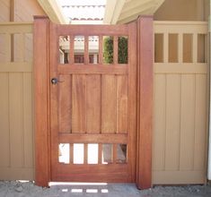 an open wooden door in front of a house