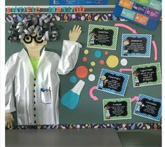 a science themed bulletin board with an image of a man wearing lab coats and holding his hands up