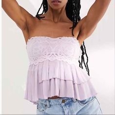 Beautiful Free People Adella Cami In Lavender Purple Color. Corset Style, Lovely Tiered Ruffles Detail At Bottom, Strapless, Lace Bodice, Smocked Detail At Back With Nice Stretch And Comfort. 69% Viscose, 19% Nylon, 12% Cotton. Lace Bodice: 95% Viscose, 5% Spandex. Brand New With Tags Hand Wash Cold. Spring Bandeau Lace Top, Spring Lace Bandeau Top, Lace Bandeau Top For Spring, Fitted Mauve Summer Top, Fitted Mauve Top For Summer, Purple Lace Tops For Spring, Purple Lace Top For Spring, Purple Strapless Top For Spring, Purple Lace Top