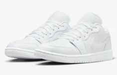 Elevate your style with these classic and iconic Women's 12 / Men's 10.5 Nike Air Jordan 1 Low sneakers. With a sleek white leather upper and a bold swoosh logo accent, these shoes are perfect for any season and occasion. The lace-up closure ensures a secure fit, while the cushioned insole and comfortable outsole make them ideal for gym and training, walking, school, basketball, and hiking. Made with high-quality materials and attention to detail, these Air Jordan 1 Low sneakers are a must-have Jordan 1 Low Triple White, Air Jordan 1 Low White, Air Jordan 1 Women, Jordan 1 Low White, School Basketball, Stylish Footwear, Nike Air Jordan 1 Low, Nike Brand, Nike Air Jordan 1