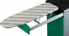 an ironing board attached to a metal stand with green drawers and white cover over it