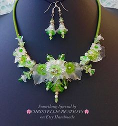 "Welcome to  CHRISTELLE CREATIONS  Jewellery and Accessories.   I. design and sell Exclusive Handcrafted jewellery using  beautiful gemstones  and more  -   Inspired by my travels around the World 🌍 (See my story below).    Each design is unique  and ready to ship now..  Feel free to contact me with any questions or requests.. Meanwhile  I hope you enjoy browsing 🌸 I have always enjoyed designing and creating the Lovely Lucite Floral jewellery -  it is so interesting to make, but takes several hours to complete. I think it is worth it. ⭐️ DESIGN:-   GREEN and WHITE  LUCITE  BOUQUET with lovely LUCITE FLORALS,  CZECH crystals, TITANIUM crystals and seed pearls,  stranded  on South Sea Island Shell Pearls. THIS DESIGN  IS MADE  TO ORDER AT THE MOMENT🌸 DIMENSIONS:-    Length approx. 56cm ( Green Pearl Necklace, Leaf Jewellery, Crystal Pearl Earrings, Vintage Style Necklace, Green Bouquet, Lucite Jewelry, Green Pearls, Floral Jewellery, Green Necklace