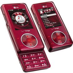 two red cell phones sitting side by side on top of each other, one with an alarm clock