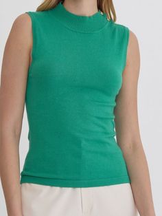 Add a touch of quirkiness to your wardrobe with the LYDIA HIGH NECK SLEEVELESS TOP. Featuring button detail at the shoulder and available in three fun colors, this knit top is perfect for those who don't take themselves too seriously. Style with your favorite jeans for a unique and fun outfit. 100% Nylon See size chart in photos. Solid Stretch Knit Top With Crew Neck, Stretch Knit Top With Crew Neck, Solid Color Cotton Knit Top With Ribbed Neckline, Ribbed Neckline Knit Turtleneck Tops, Cotton Knit Top With Ribbed Neckline, Knit Turtleneck Top With Ribbed Neckline, Spring Green Stretch Knit Top, Spring Green Crew Neck Tank Top, Green Stretch Knit Top For Spring