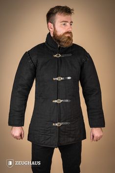 This versatile gambeson features a convenient front opening secured with sturdy buckles, allowing for swift dressing. Included are both long and short sleeves, catering to your preference and adapting to varying weather conditions. Designed for optimal mobility, this gambeson retains an open underarm area. The nestable arms ensure ease of movement and versatility in combat scenarios. Experience enhanced agility without compromising on protection with our thoughtfully crafted gambeson. Color: Bla Gambeson Woman, Viking Gambeson, Man At Arms Medieval, Men At Arms Medieval, Quilted Gambeson, Black Week, Medieval Fashion, Hair And Beard Styles, Front Open