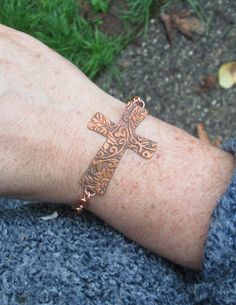 Copper Vines and Spirals Cross Bracelet https://www.etsy.com/listing/1091961708/copper-vines-and-spirals-cross-bracelet?utm_source=crowdfire&utm_medium=api&utm_campaign=api Copper Cross Jewelry For Gifts, Adjustable Etched Copper Jewelry, Handmade Copper Bracelet, Heart Cross Necklace, Tiny Cross Necklace, Wedding Bracelets, Sterling Silver Cross Necklace, Silver Jewellery Sets, Cross Bracelet