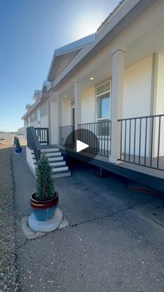 an empty building with stairs leading up to it