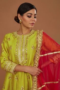 Lime yellow dupion short anarkali with gota embroidery. Comes with churidar and a fuchsia organza dupatta. - Aza Fashions Pista Green Raw Silk Churidar For Festivals, Gold Fitted Churidar In Dola Silk, Fitted Slub Silk Sharara For Festivals, Fitted Gold Dola Silk Churidar, Festival Pista Green Churidar In Raw Silk, Gold Fitted Dola Silk Churidar, Diwali Churidar With Cutdana In Tissue Silk, Diwali Churidar With Cutdana On Tissue Silk, Festive Yellow Art Silk Churidar