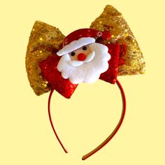 a santa claus headband with sequins and gold sequins on it