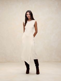 We selected one of our favorite all-season yarns for this long midi dress, employing a half-Milano stitch for its smooth handfeel and soft structure.  Column fit.  Crew neck.  Wrap-front detail.  Unlined.  Column fit.  Sleeveless.  Midi length.  Model: Size S, 5'10" (178cm). Sleek Knee-length Maxi Dress For Spring, Spring Viscose Midi Dress With Side Slits, Chic Knee-length Midi Dress With Side Slits, Chic Solid Color Midi Dress, Chic Beige Midi Dress, Elegant Midi Dress With Asymmetrical Hem For Work, Fall Workwear Midi Dress With Side Slits, Workwear Midi Dress With Side Slits, Sleek Midi Dress With Side Slits For Work