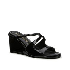 Anne Klein-Spirit Sandal Simple yet sophisticated, the Spirit sandal from Anne Klein is an easy add to any look. Whether you choose to dress it up or down, this pair will elevate your style thanks to the strappy upper with cutouts, strong wedge heel, and a glossy patent hue. Complete with a lightly cushioned iflex footbed that offers all-day support. Athleisure Sneakers, Bridal Wedding Shoes, Cold Weather Boots, Vans Style, Outdoor Boots, Slouched Boots, Black Wedge Sandals, Trending Sneakers, Athleisure Fashion