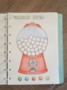 a notebook with a drawing of a gumball machine