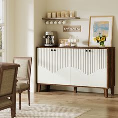 a dining room with a table and chairs next to a wall mounted coffee pot on top of a cabinet