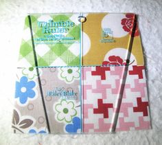 four notebooks are lined up on top of each other, with the same pattern