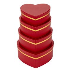 four red heart shaped boxes stacked on top of each other with gold stripes around the edges