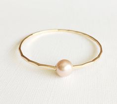 Pink Edison pearl bangle pastel pink pearl by MaimodaJewelry Elegant Pink Pearl Bangle Bracelet, Delicate Pink Pearl Bracelet For Wedding, Pink Pearl Drop Bracelet For Wedding, Pink Gold Bangle For Wedding, Pink Stackable Wedding Bangle, Bridesmaid Pearl Bracelet, Pink Pearl Bracelet, Charm Bangles, Edison Pearls