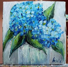 a painting of blue flowers in a vase